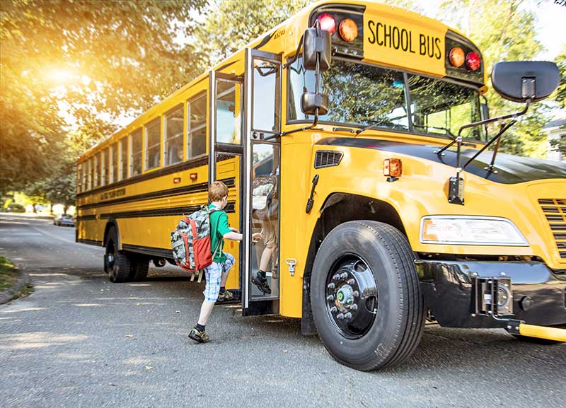 Kids Getting On School Bus