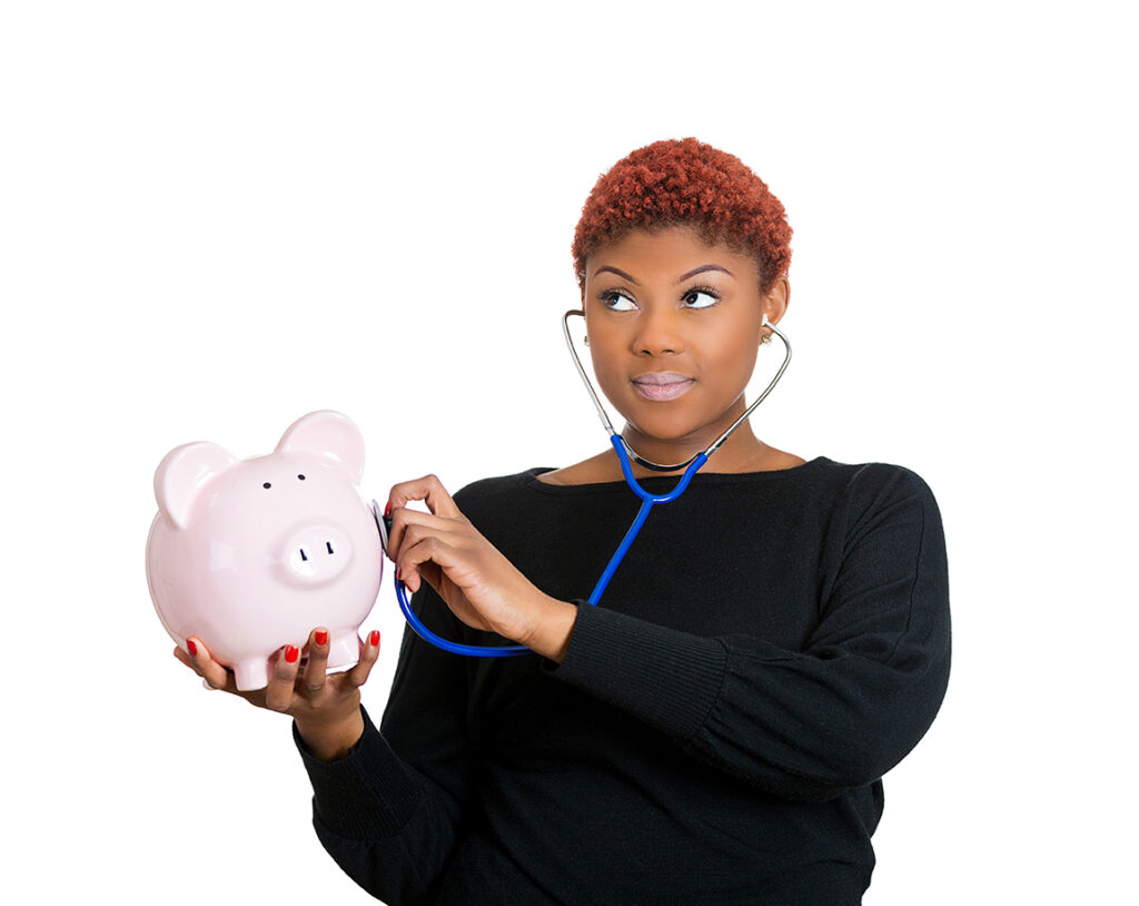 Young woman listening to piggy bank with stethoscope. Medical insurance, medicare reimbursement concept . Curious nurse, doctor, patient or business lady. Health-law coverage gap or company report