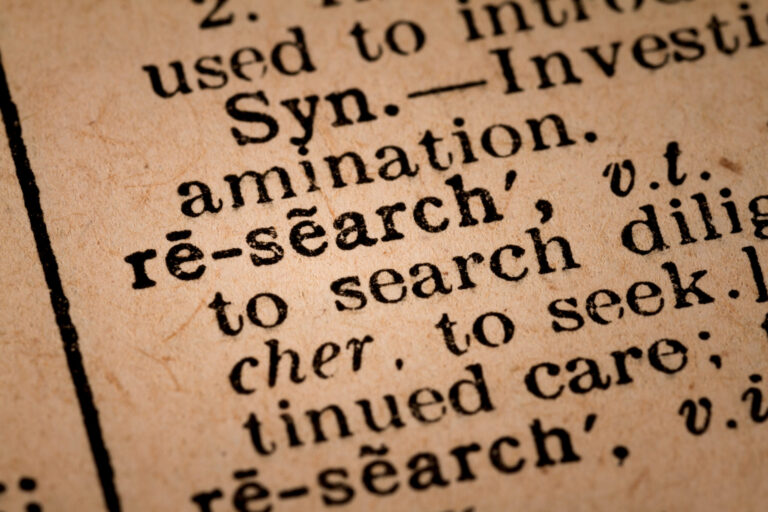 Close-up of an Opened Dictionary showing the Word RESEARCH