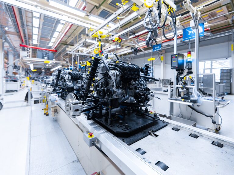 Automotive mechanical assembly, engine, transmission, suspension and breaking system. Automotive engine assembly line is in production. Car Assembly by parts